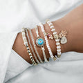 Conjunto de Pulseras Doradas con Colgante Hamsa